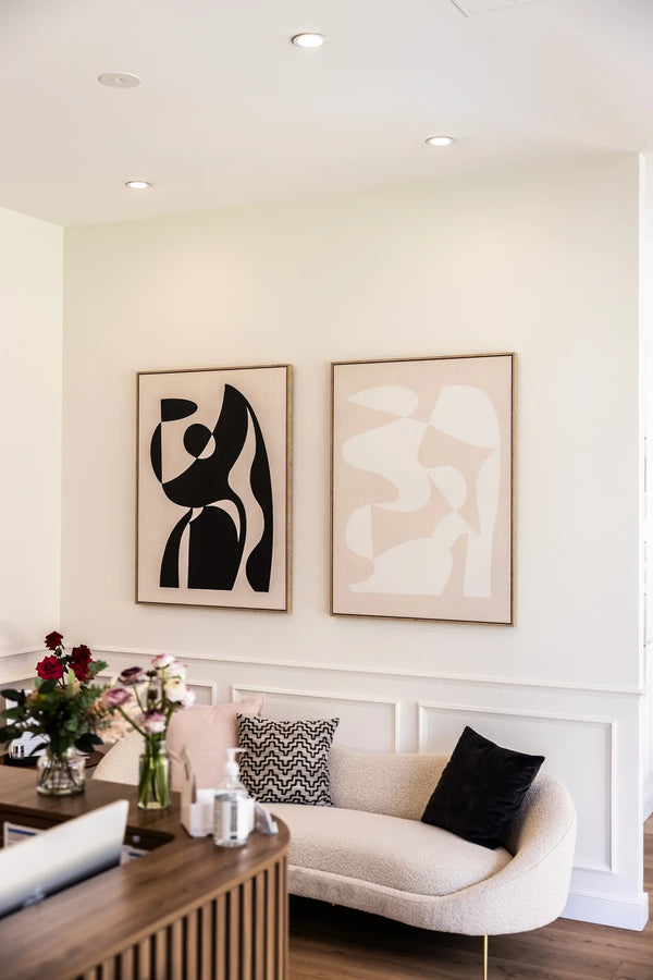 Modern living room with abstract art on the wall, a sofa, and coffee table.